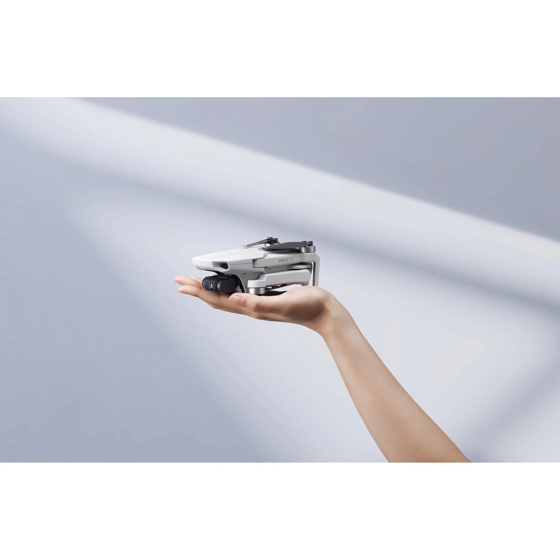 DJI Mini 2 SE Lightweight Foldable Drone with 2.7K Camera & RC Controller